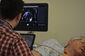 Dr McAloon performing echocardiography on a study patient to look at the structure and function of the heart.